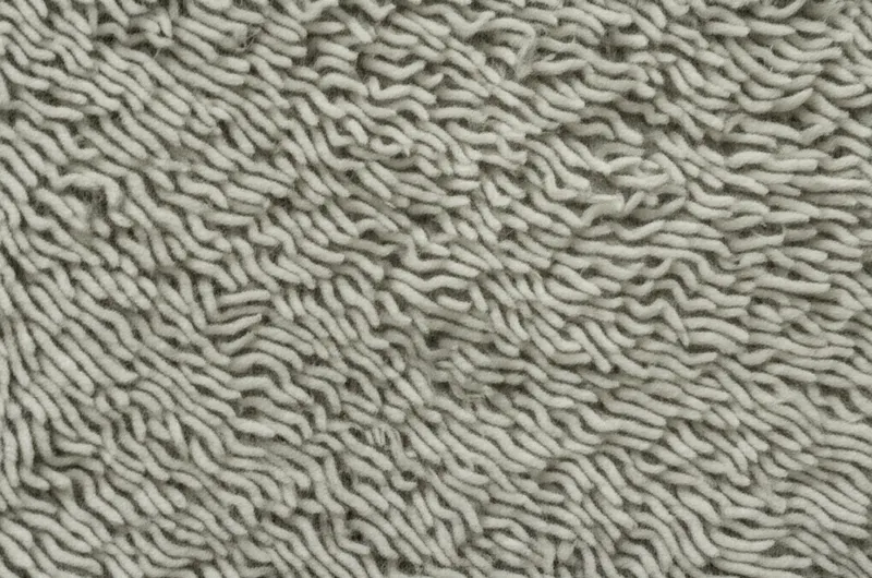 单词"frieze"的视觉插图 - 粗呢，毛呢。
